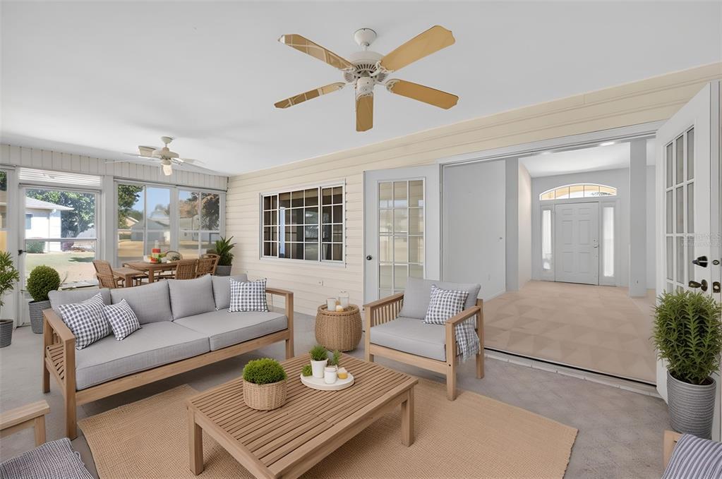 8739 Southeast 140th Place Road Summerfield, FL 34491 - Photo 37 of 45 a living room with furniture a fireplace and a table