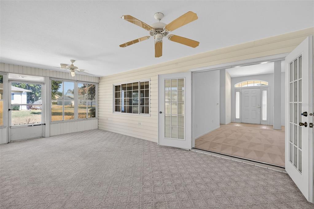 8739 Southeast 140th Place Road Summerfield, FL 34491 - Photo 38 of 45 a view of livingroom with hardwood floor and ceiling fan