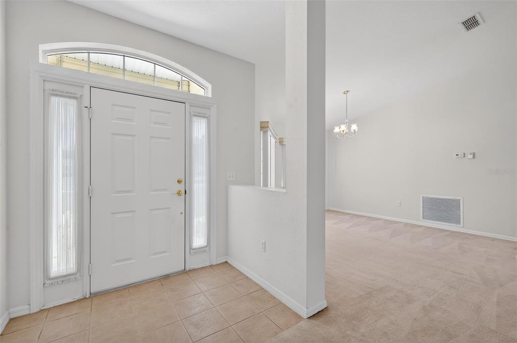 8739 Southeast 140th Place Road Summerfield, FL 34491 - Photo 4 of 45 an empty room with windows and closet