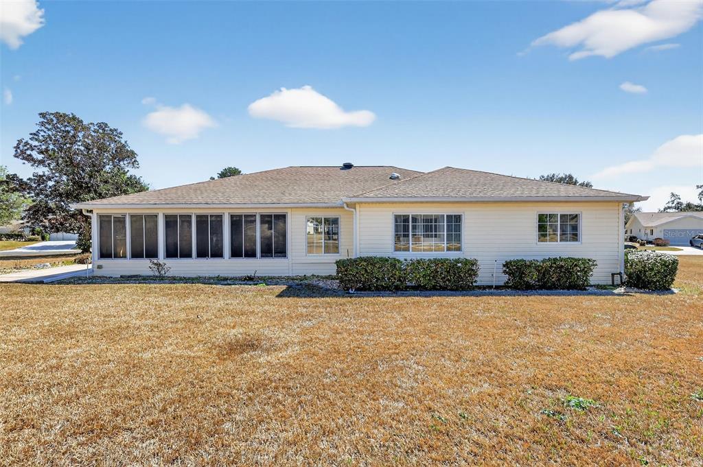 8739 Southeast 140th Place Road Summerfield, FL 34491 - Photo 43 of 45 a front view of a house with a yard