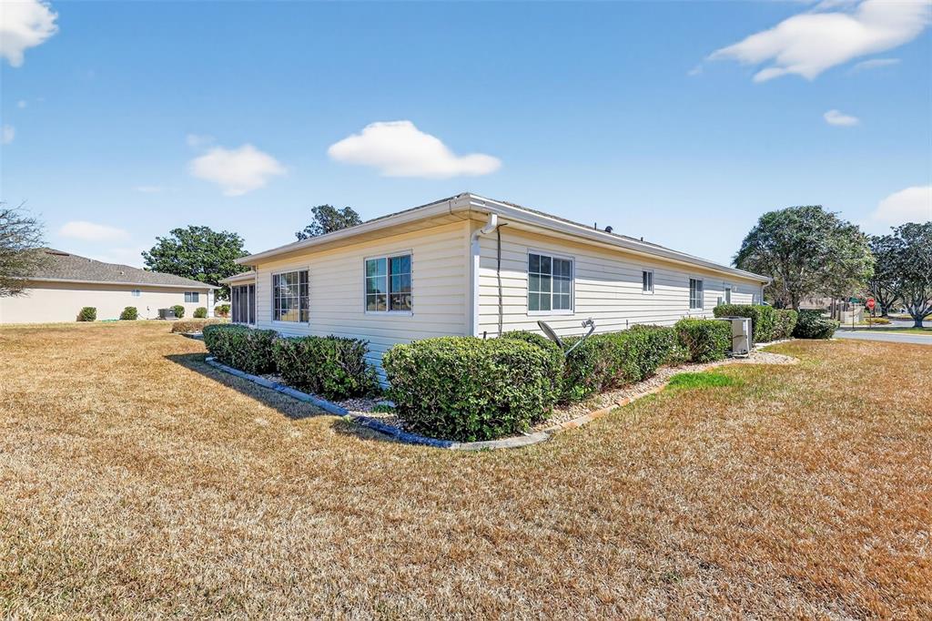 8739 Southeast 140th Place Road Summerfield, FL 34491 - Photo 45 of 45 a front view of a house with garden