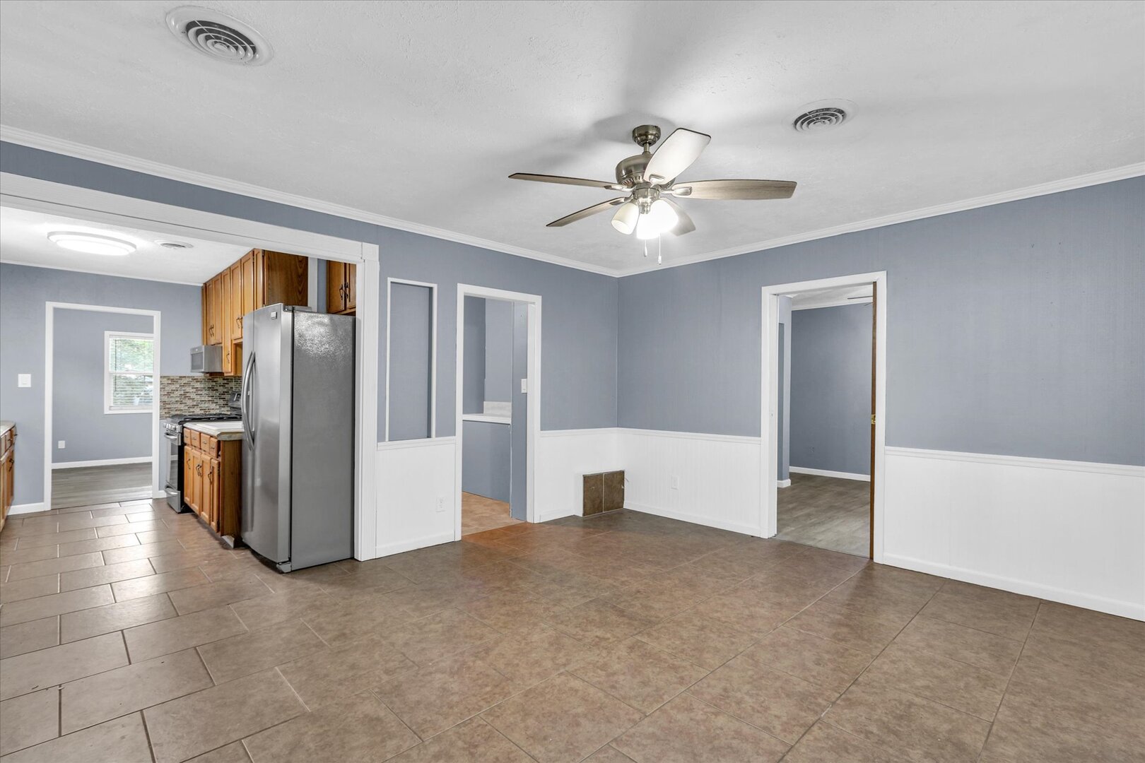 817 Roselyn Drive Rantoul, IL 61866 - Photo 13 of 33 a view of a kitchen with a refrigerator a microwave and a sink
