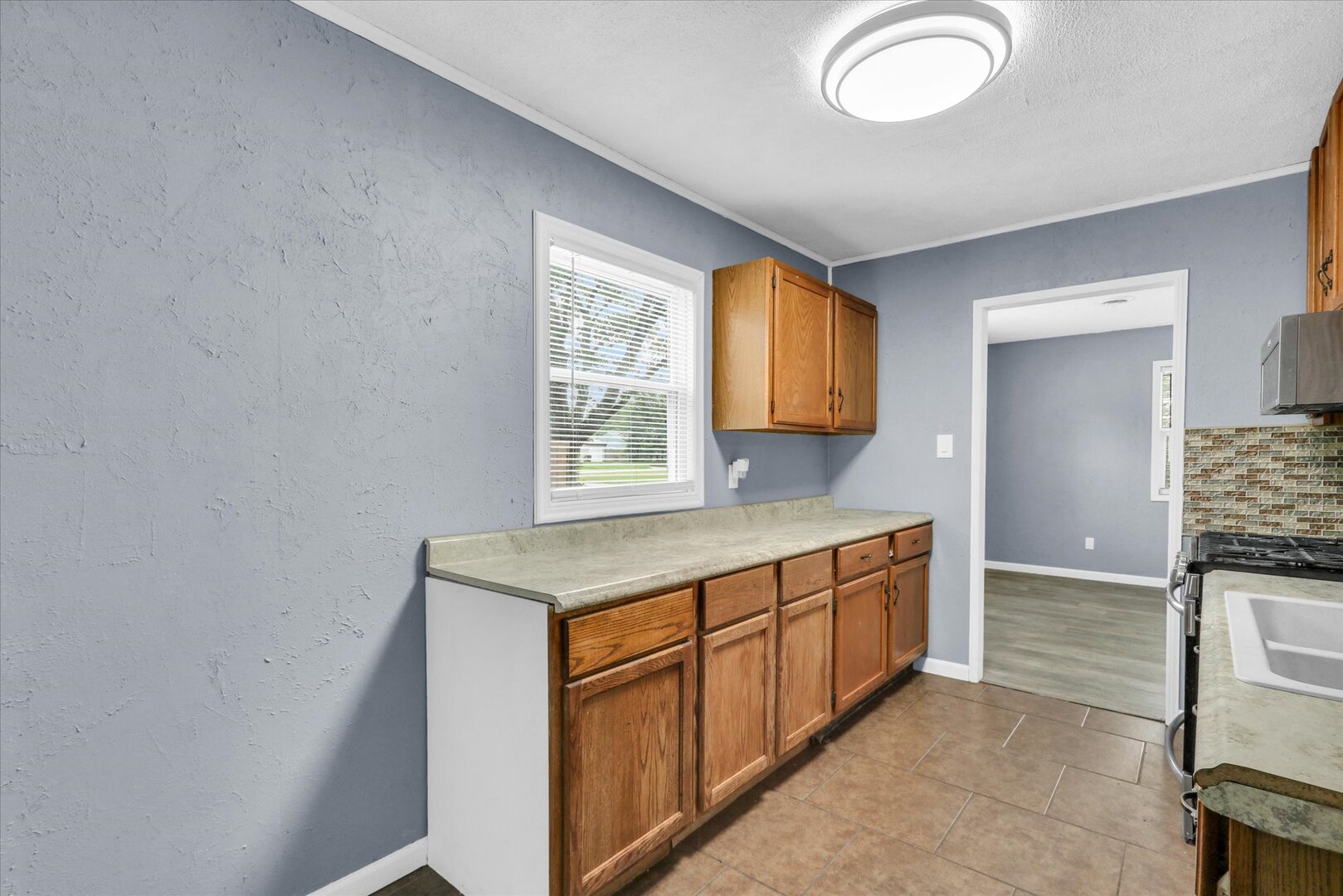 817 Roselyn Drive Rantoul, IL 61866 - Photo 10 of 33 a room with a sink and a mirror