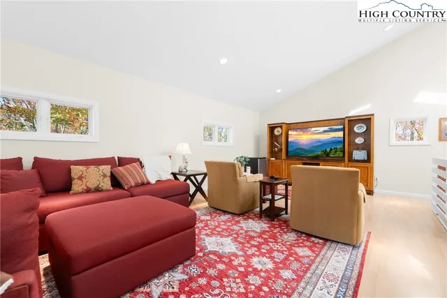 a spacious bedroom with two beds and a dresser