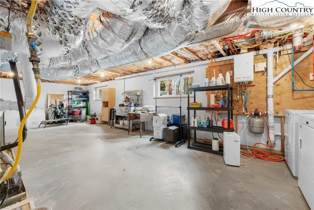 a view of a large yard with plants and trees