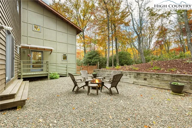 a living room with furniture a couch and a chandelier