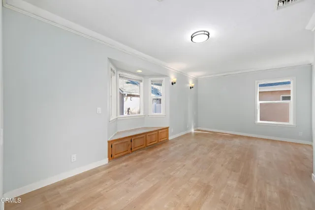 a view of an empty room with a window