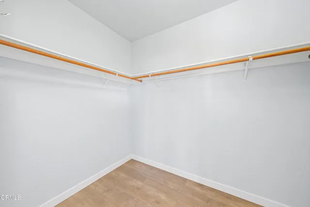 a view of a room with shelf on the wall