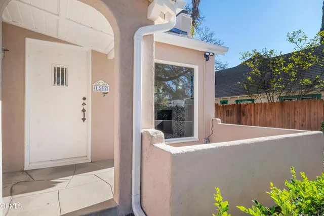 a outdoor view living space with hardwood floor and a potted plant