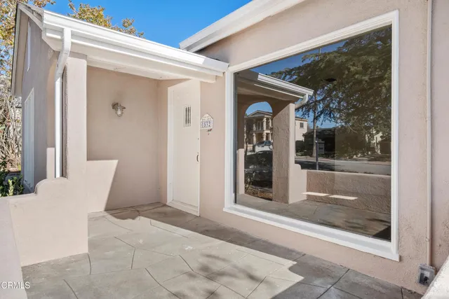 a view of a door and chair in front of a door