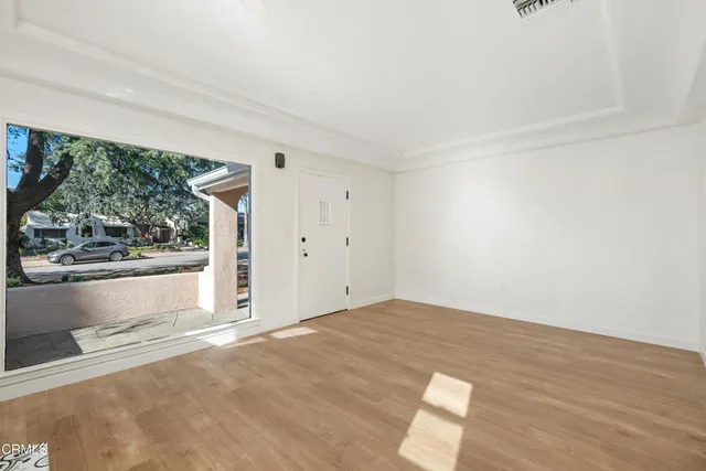 a view of an empty room with a window