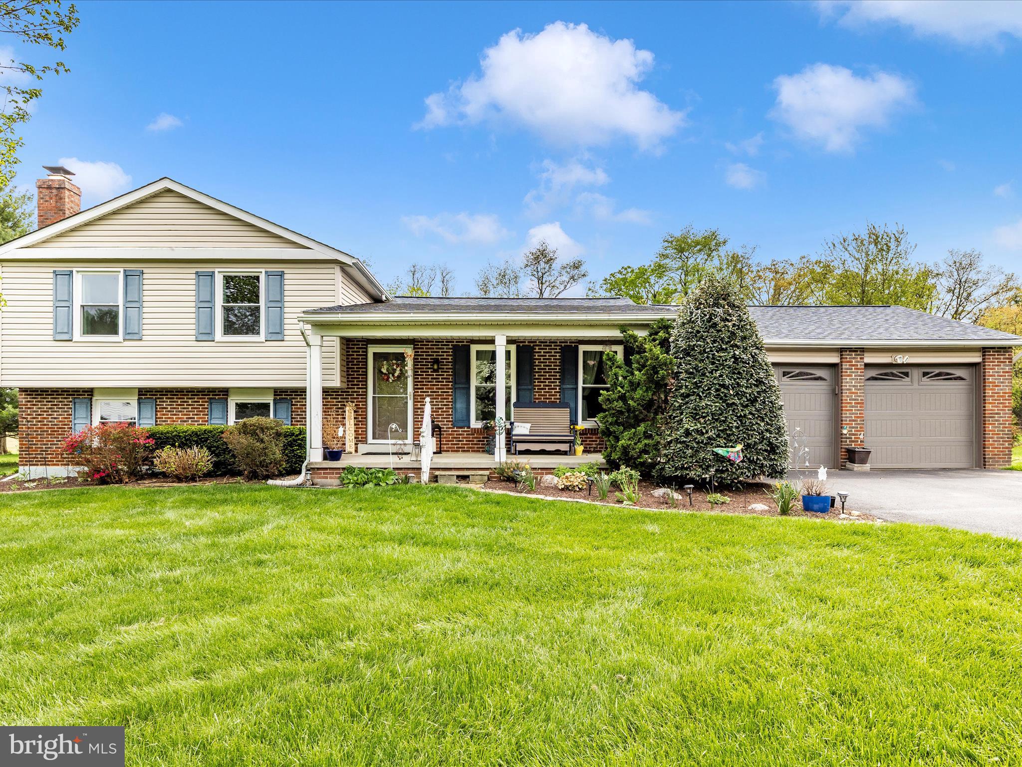 5903 Char Leigh Circle Frederick, MD 21703 - Photo 1 of 62 a front view of a house with a yard and porch