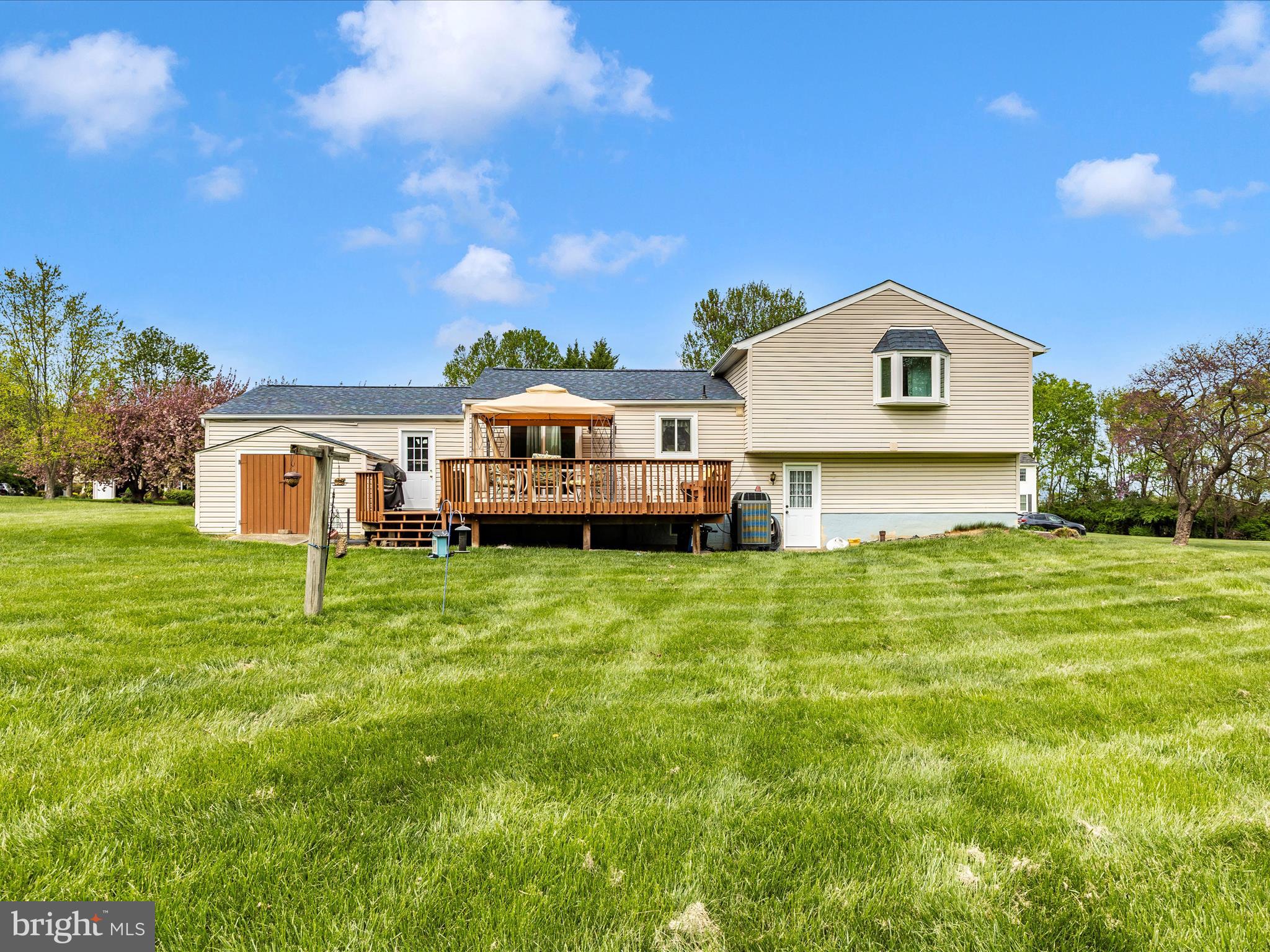 5903 Char Leigh Circle Frederick, MD 21703 - Photo 4 of 62 a front view of a house with a garden and deck