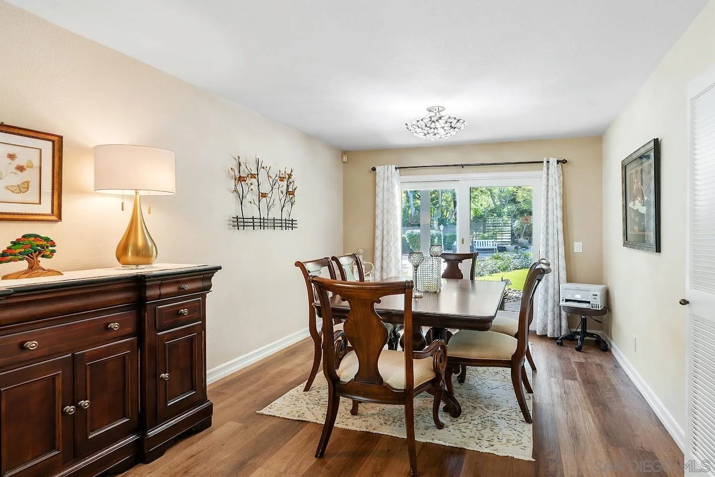 14922 Derringer Road Poway, CA 92064 - Photo 16 of 66 a view of a dining room with furniture window and wooden floor