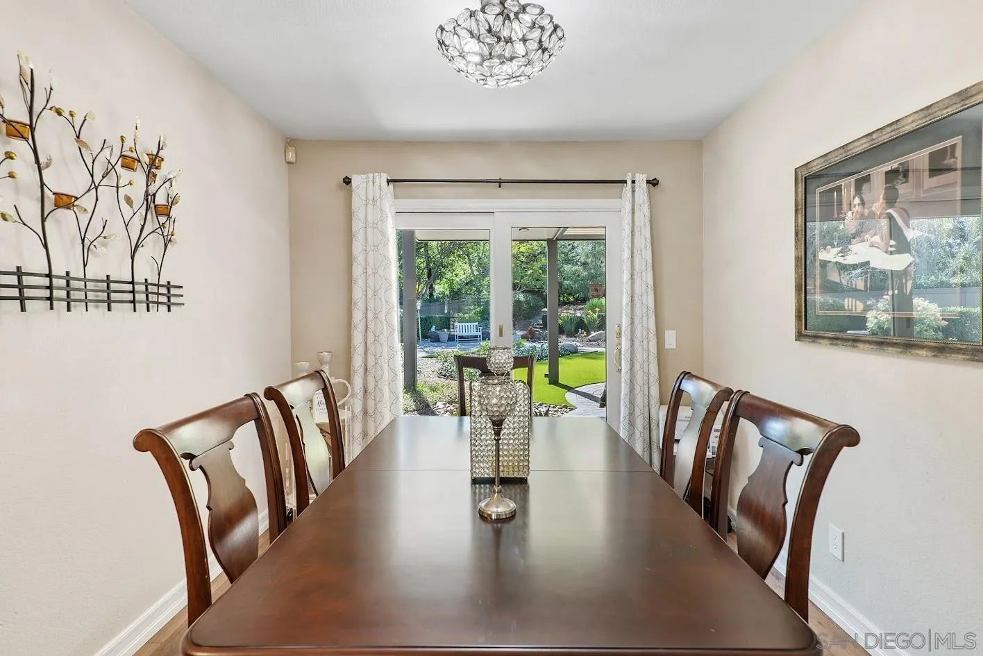 14922 Derringer Road Poway, CA 92064 - Photo 17 of 66 a view of a dining room with furniture a chandelier and wooden floor