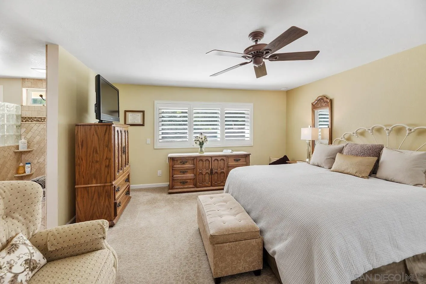 14922 Derringer Road Poway, CA 92064 - Photo 21 of 66 a bedroom with a bed and a refrigerator