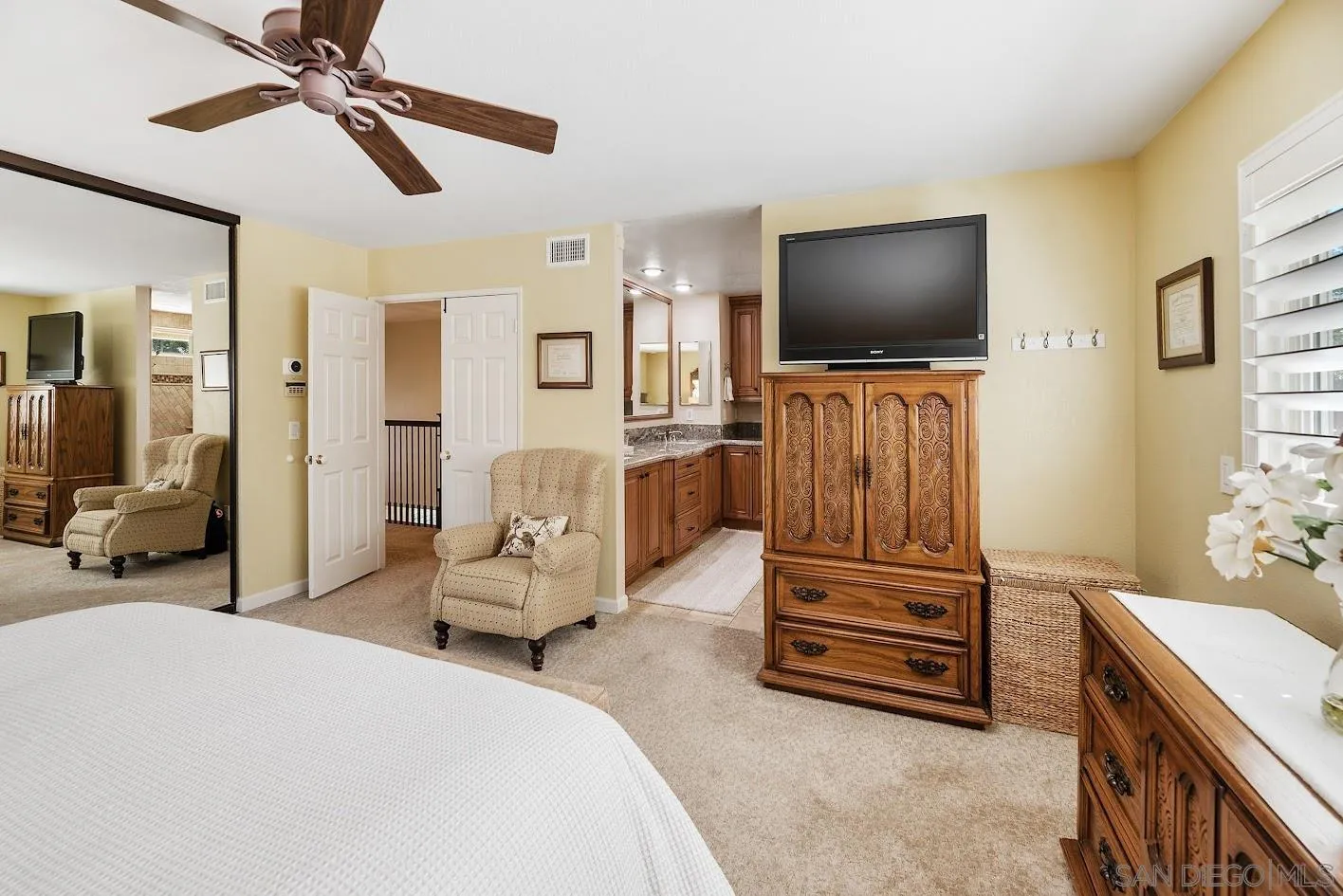 14922 Derringer Road Poway, CA 92064 - Photo 23 of 66 a bedroom with furniture and a flat screen tv
