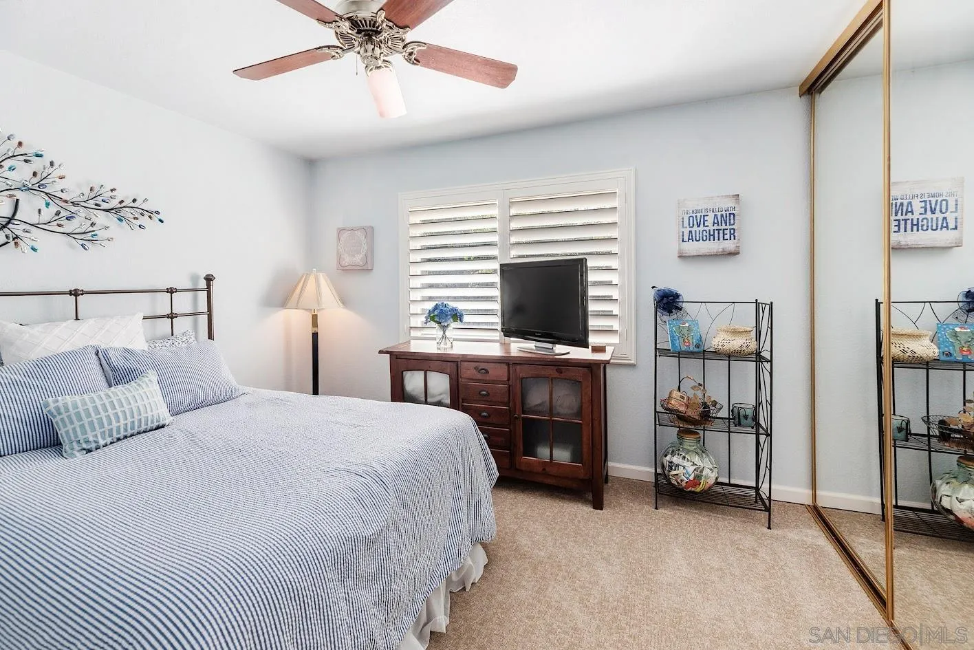 14922 Derringer Road Poway, CA 92064 - Photo 32 of 66 a bedroom with a bed and a flat tv screen on dresser