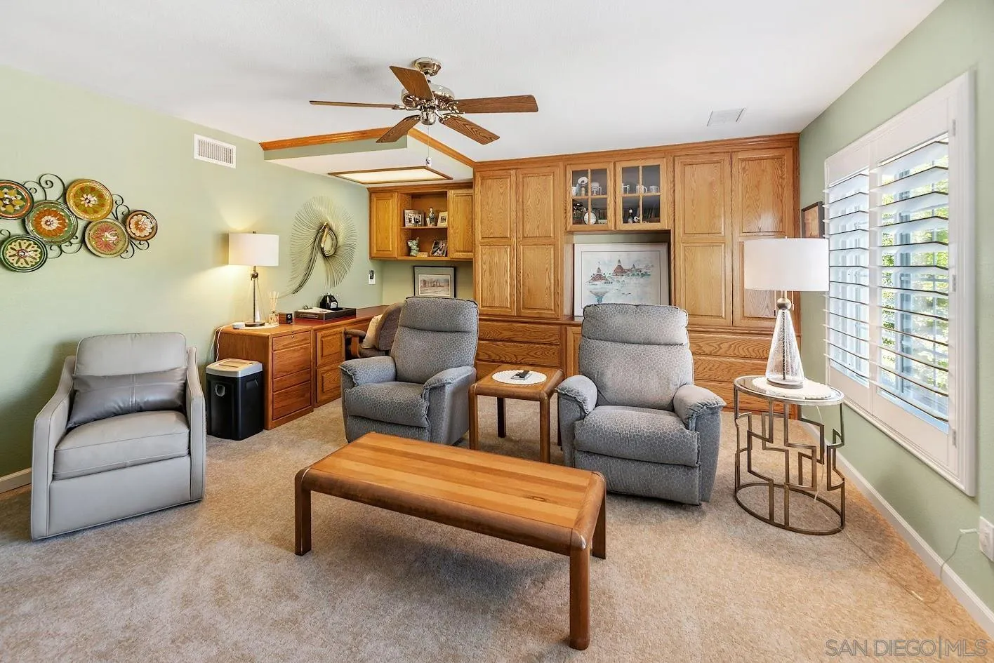 14922 Derringer Road Poway, CA 92064 - Photo 36 of 66 a living room with furniture and a chandelier