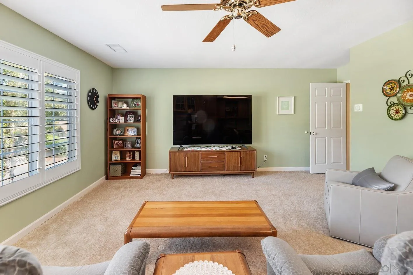 14922 Derringer Road Poway, CA 92064 - Photo 37 of 66 a living room with furniture and a flat screen tv