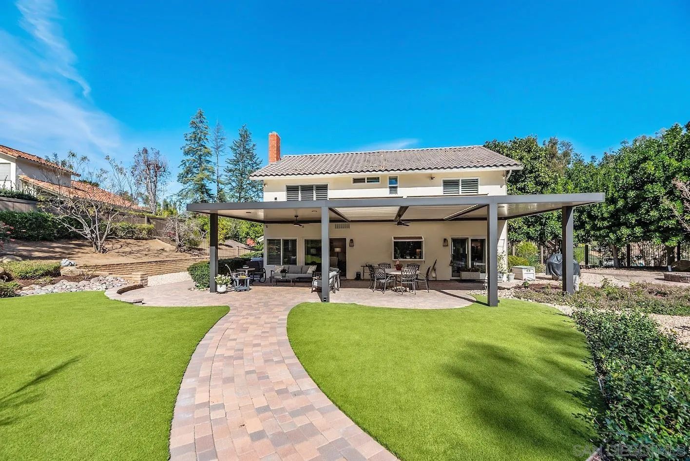 14922 Derringer Road Poway, CA 92064 - Photo 52 of 66 a view of a house with swimming pool and sitting area