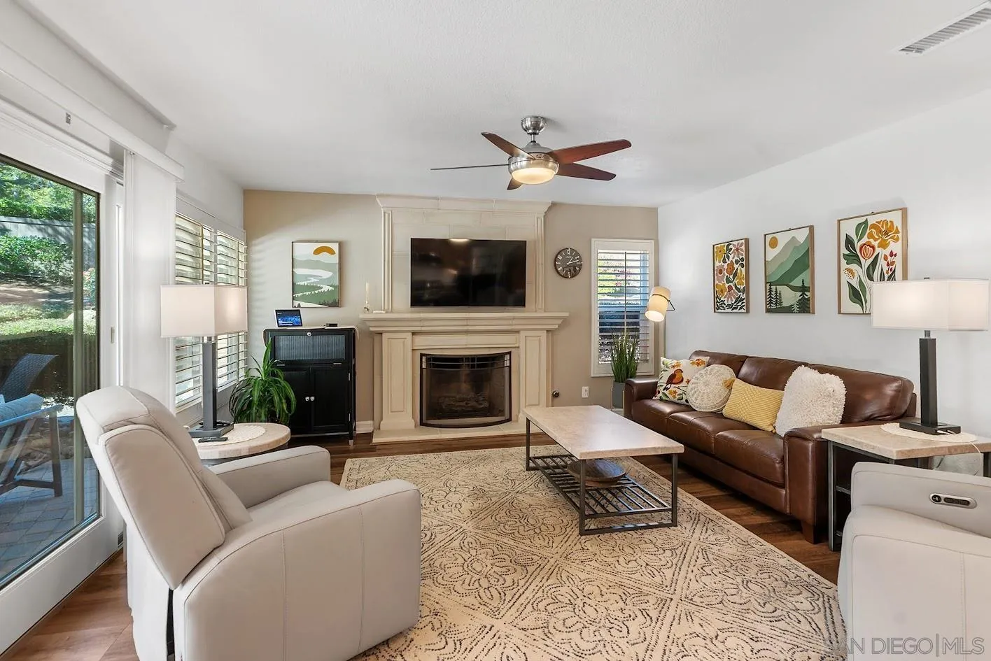 14922 Derringer Road Poway, CA 92064 - Photo 10 of 66 a living room with furniture a fireplace and a flat screen tv