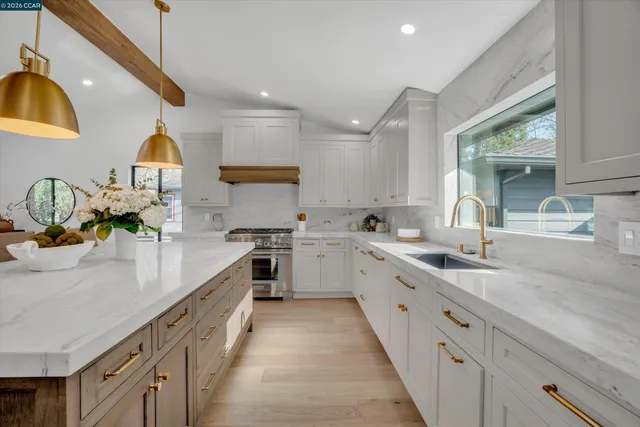 a bathroom with a sink toilet vanity and shower