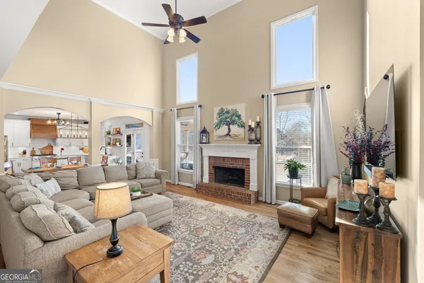 a view of a dining room with furniture wooden floor and chandelier