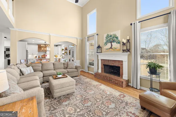 a kitchen with stainless steel appliances a sink a stove a refrigerator and cabinets