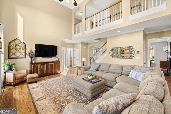 a kitchen with granite countertop a refrigerator stove and microwave