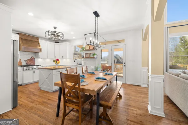 a kitchen with a sink cabinets and window