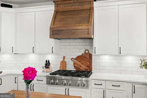 a bedroom with a bed and a view of bathroom