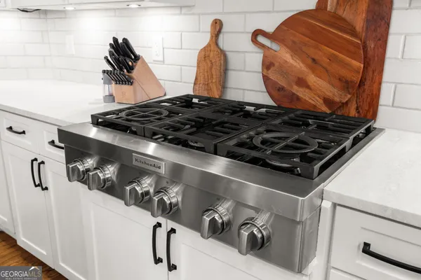a view of a two chairs and table in the balcony