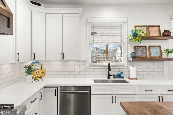 a view of a yard with snow on the road