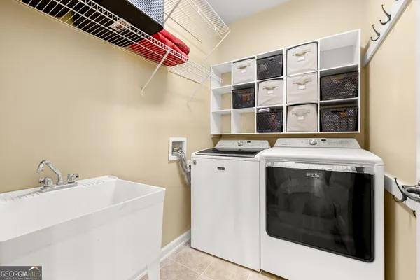 a bedroom with a bed and a ceiling fan