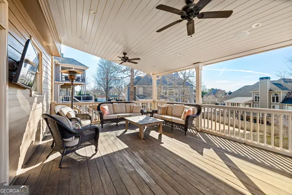 a white bath tub sitting next to a white wall