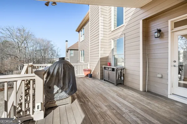 a spacious bathroom with a sink mirror and a shower