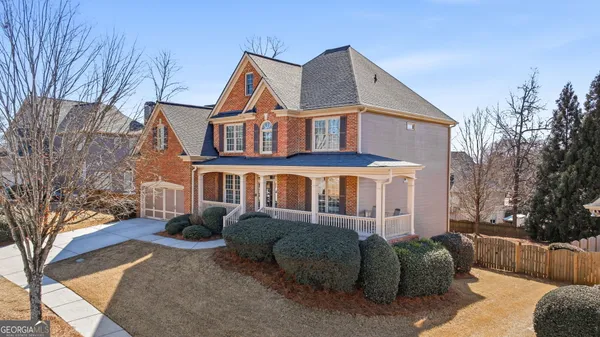 a front view of a house with a yard