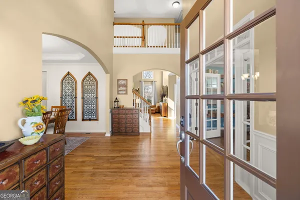 a living room with furniture and a book shelf