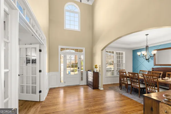a view of a dining room with furniture window and wooden floor
