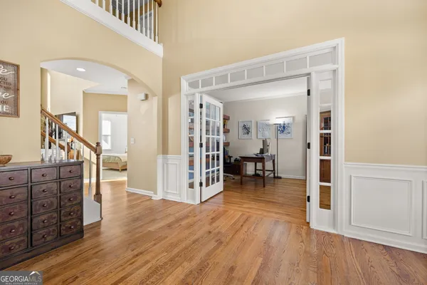 a living room with furniture large window and a fireplace