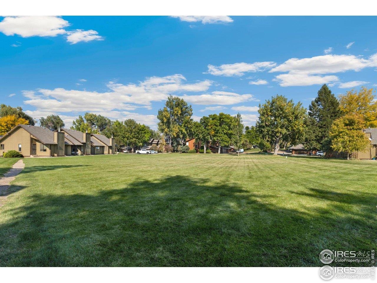 1935 Waters Edge Street, Unit C Fort Collins, CO 80526 - Photo 17 of 26 a view of green field