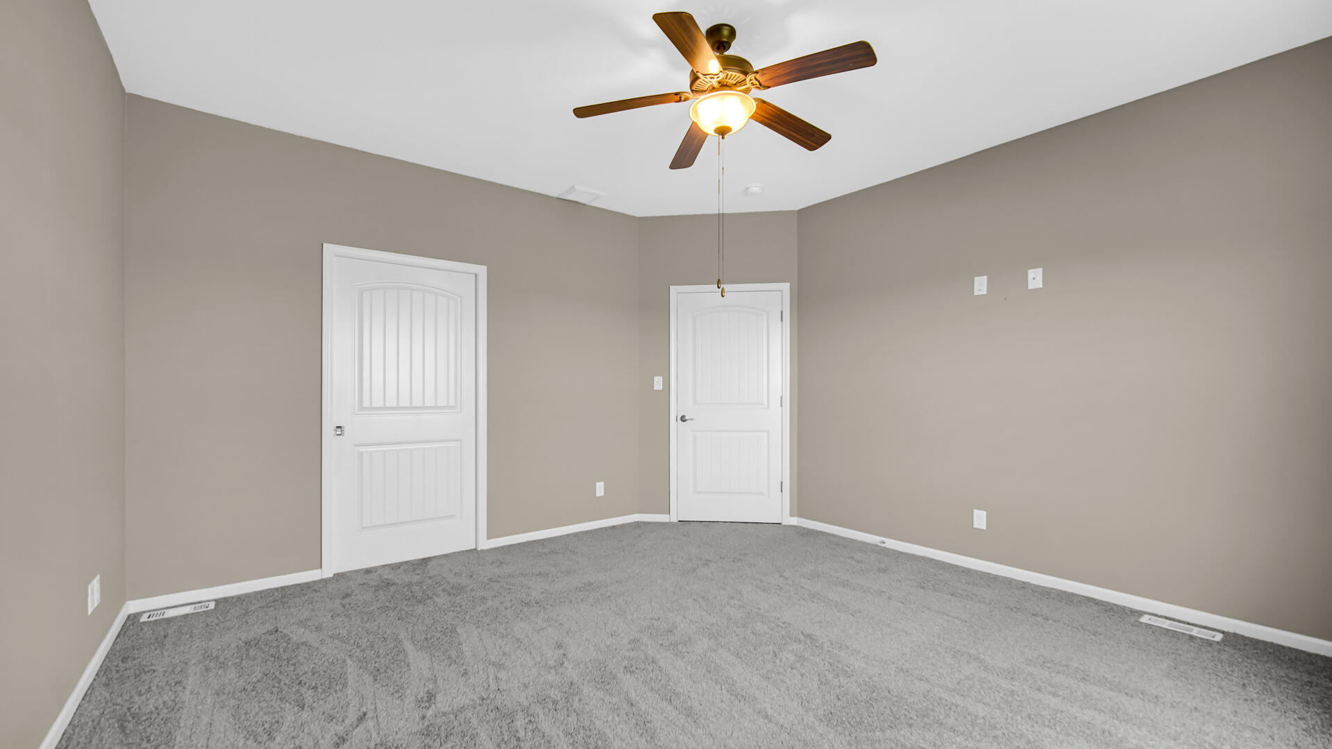 3889-91 Stadium Street Portage, IN 46368 - Photo 16 of 23 a view of a big room with a ceiling fan and a chandelier fan