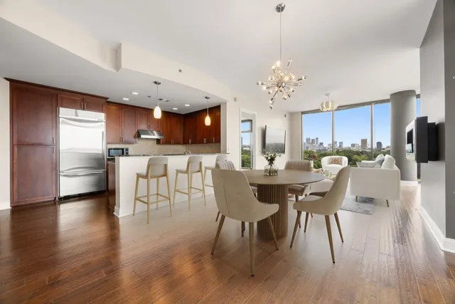 a view of a dining room with furniture and wooden floor