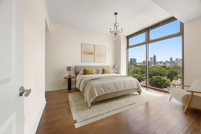 a spacious bedroom with a bed and a window