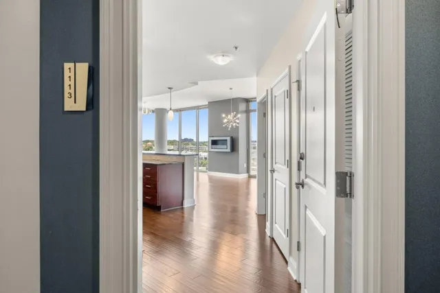 a view of a kitchen with a refrigerator and a window