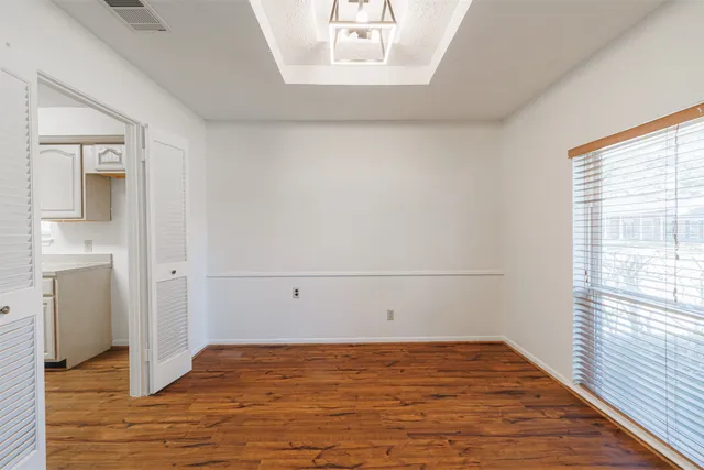 a kitchen with stainless steel appliances a stove a sink and a refrigerator