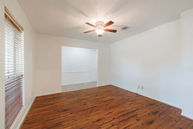a dining room with furniture a rug and wooden floor