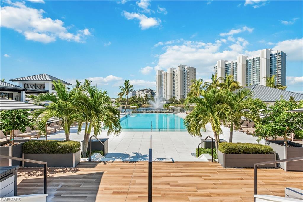 13955 Old Coast Road, Unit 804 Naples, FL 34110 - Photo 7 of 14 a view of a palm tree in front of a building