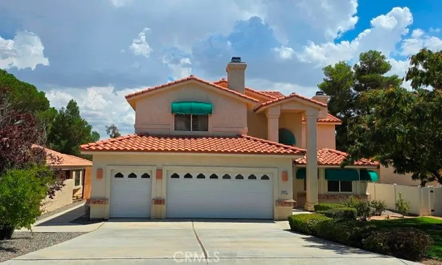 a front view of a house with a garage